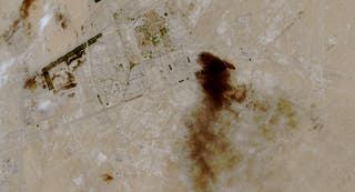 A satellite view of smoke billowing at a Saudi Aramco oil facility after a reported attack